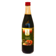 Lasipullo Al-Quds granaattiomenasiirappia 600ml, itämainen tuote punaisella korkilla.