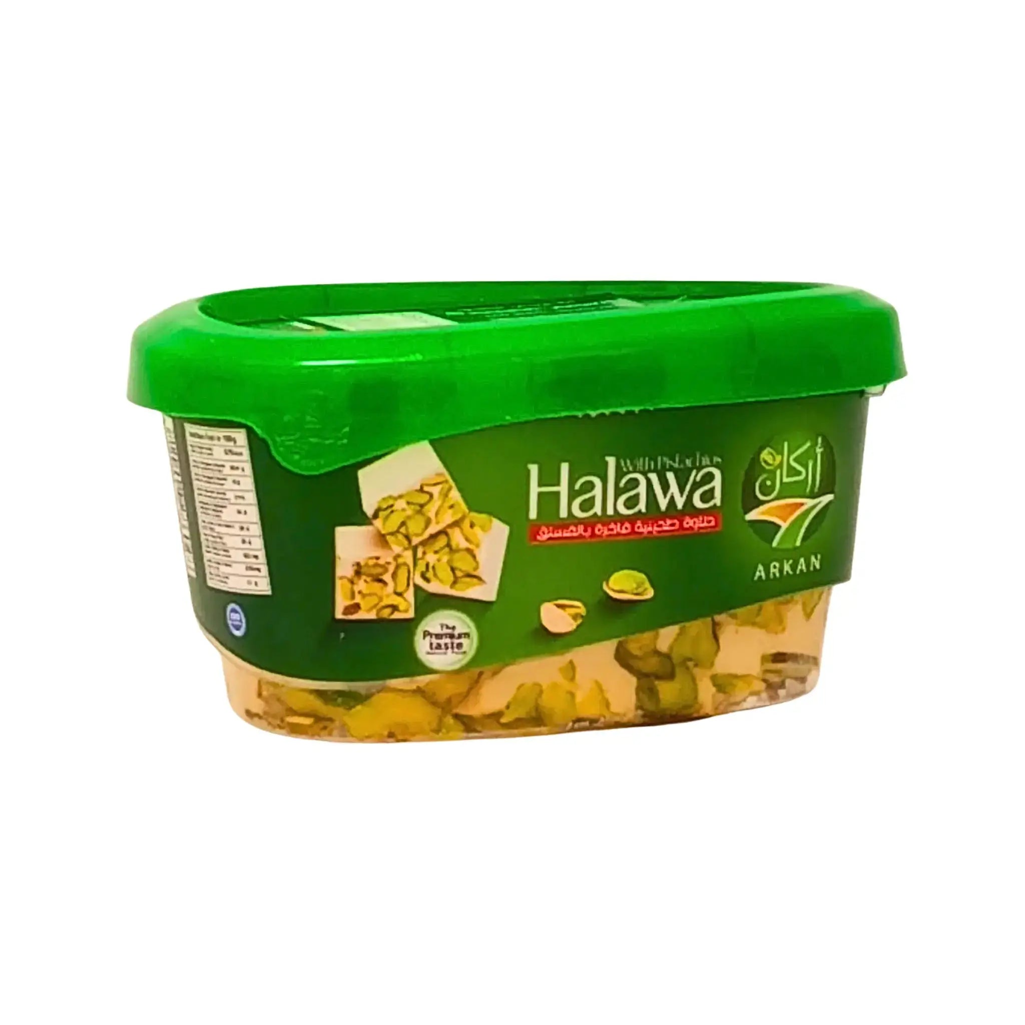 Plastipurkki halawaa pistaasipähkinöillä, vihreä kansi ja itämainen kuviointi etiketissä.