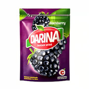 Darina-juomijauhetta mustikanvärinen purkissa, lila pakkaus, instant-juomasekoitus marjamotivilla.