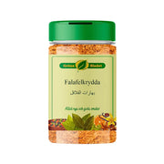 Falafel-mausteet itämaisina mausteina läpinäkyvässä rasiassa vihreällä kannella Gröna Bladetista