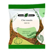 Gröna Bladet Chai masala -krydrasekoitus 30 g teä varten, vihreiden kasvien ja mausteiden kuvitukset pakkauksessa.
