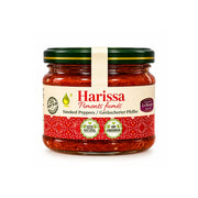 Harissa i glasburk med röd chilipepparmix och grön skruvlock.