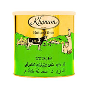 Kultavihreä purkki ghee-voita, kuvitettu lehmä ja nainen, teksti Butter Ghee, 2 kg.