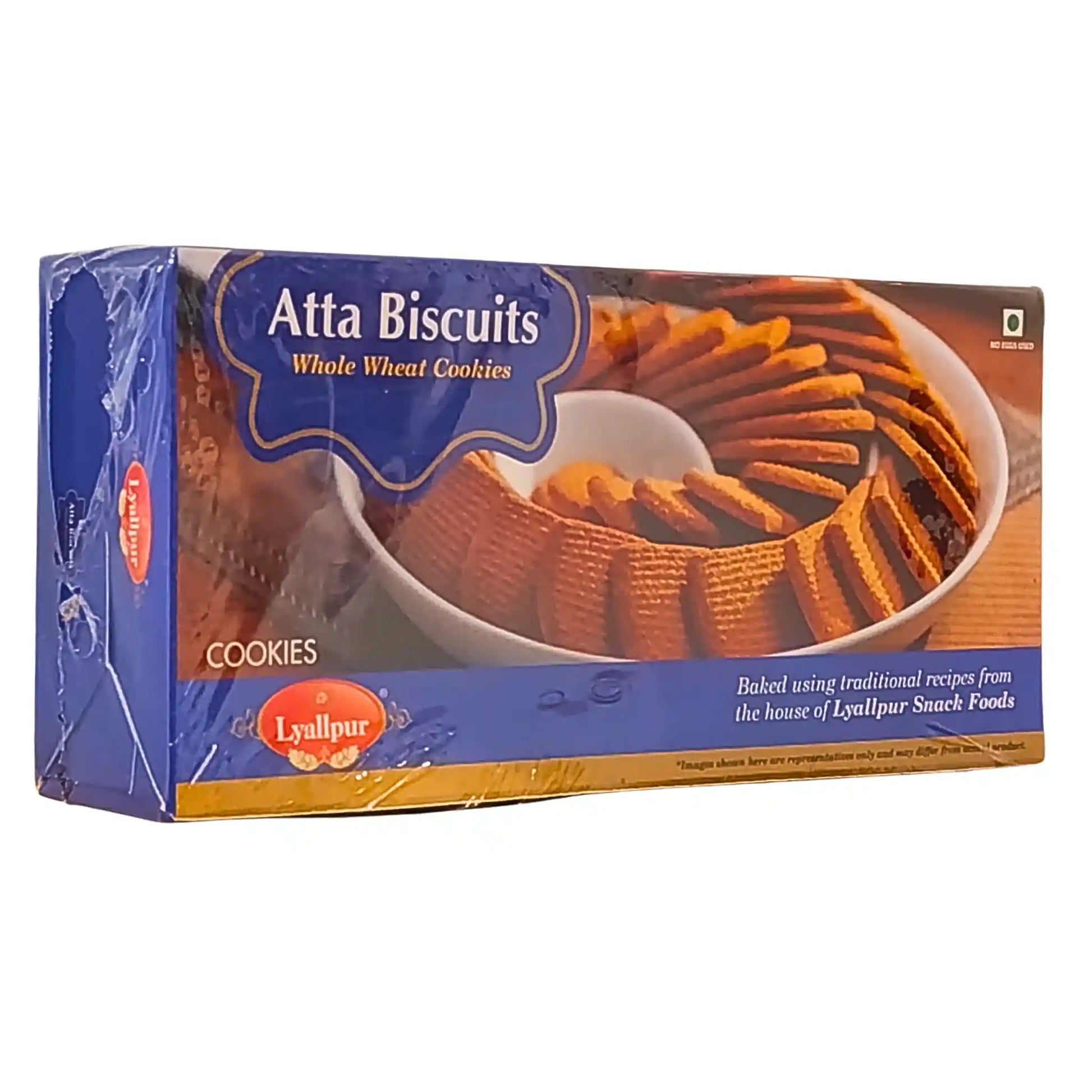 Pakkaus, jossa on Atta Biscuits -täysjyväkeksejä, esitetty pöydällä, itämaalainen leivonta.