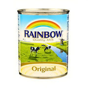 Purkki Rainbow-maitokonsentraattia alkuperäistä, lehmiä vihreällä niityllä ja sateenkaari etiketissä.