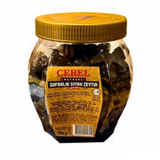 Purkki ytimellisiä mustia oliiveja Cebel, 700g, kultainen kansi ja selkeä etiketti.