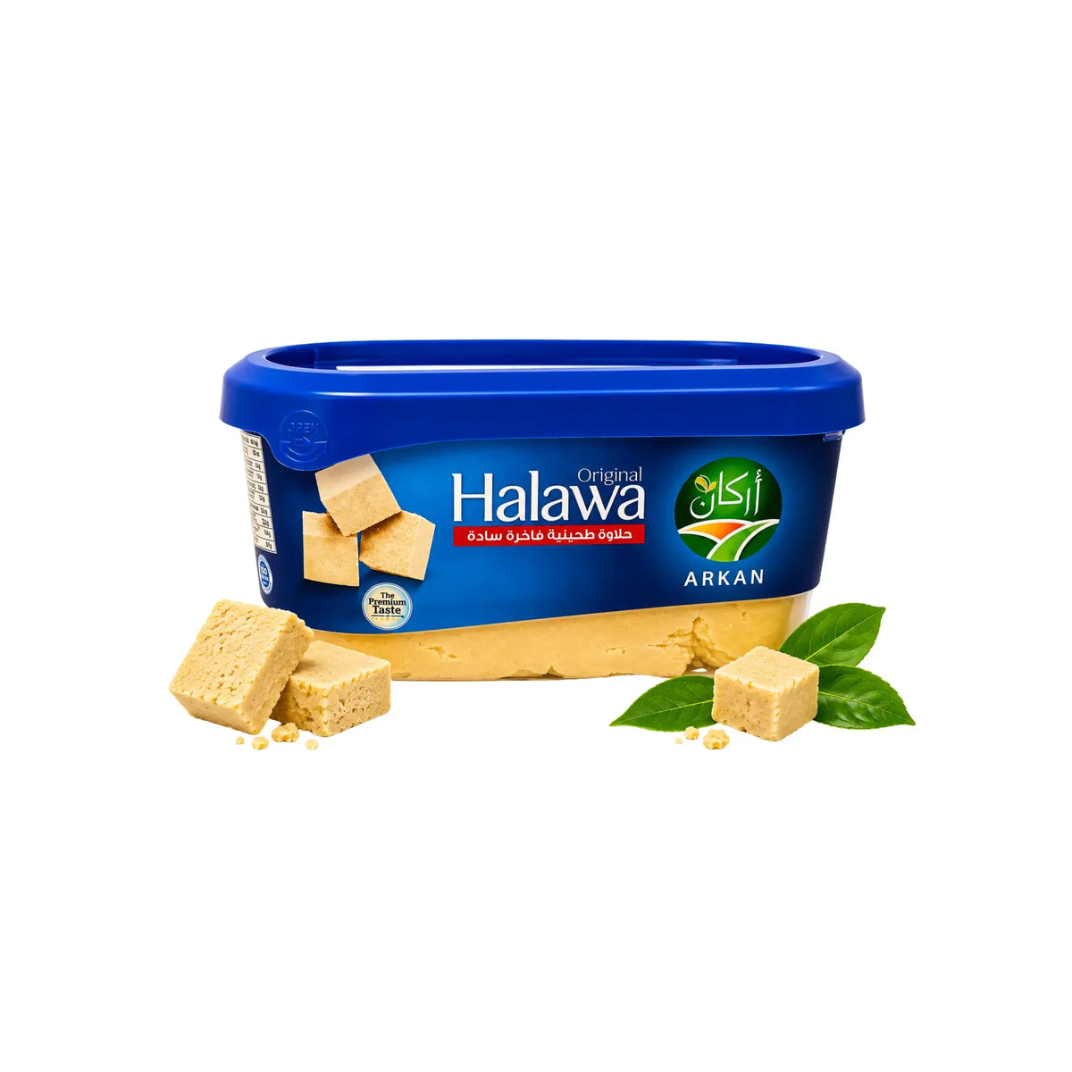 Blå halawa i plastburk med lock, sesambitar och gröna blad