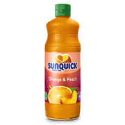 Sunquick aprikoosi- ja persikkamehun konsentraatti 700 ml pullossa, vihreä korkki, hedelmäkuvia etiketissä.