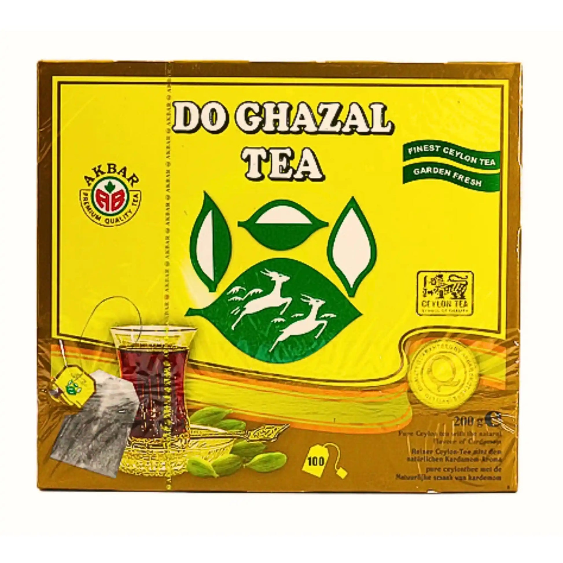 Do Ghazal -tepakkaus, kardemumman maku, 100 teepussia, keltainen pahvipakkaus teelasin ja kardemummahedelmien kuvilla.