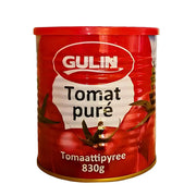 Keltainen tomaattimurska 830 g purkissa, itämainen tomaattimurska valkoisella taustalla.