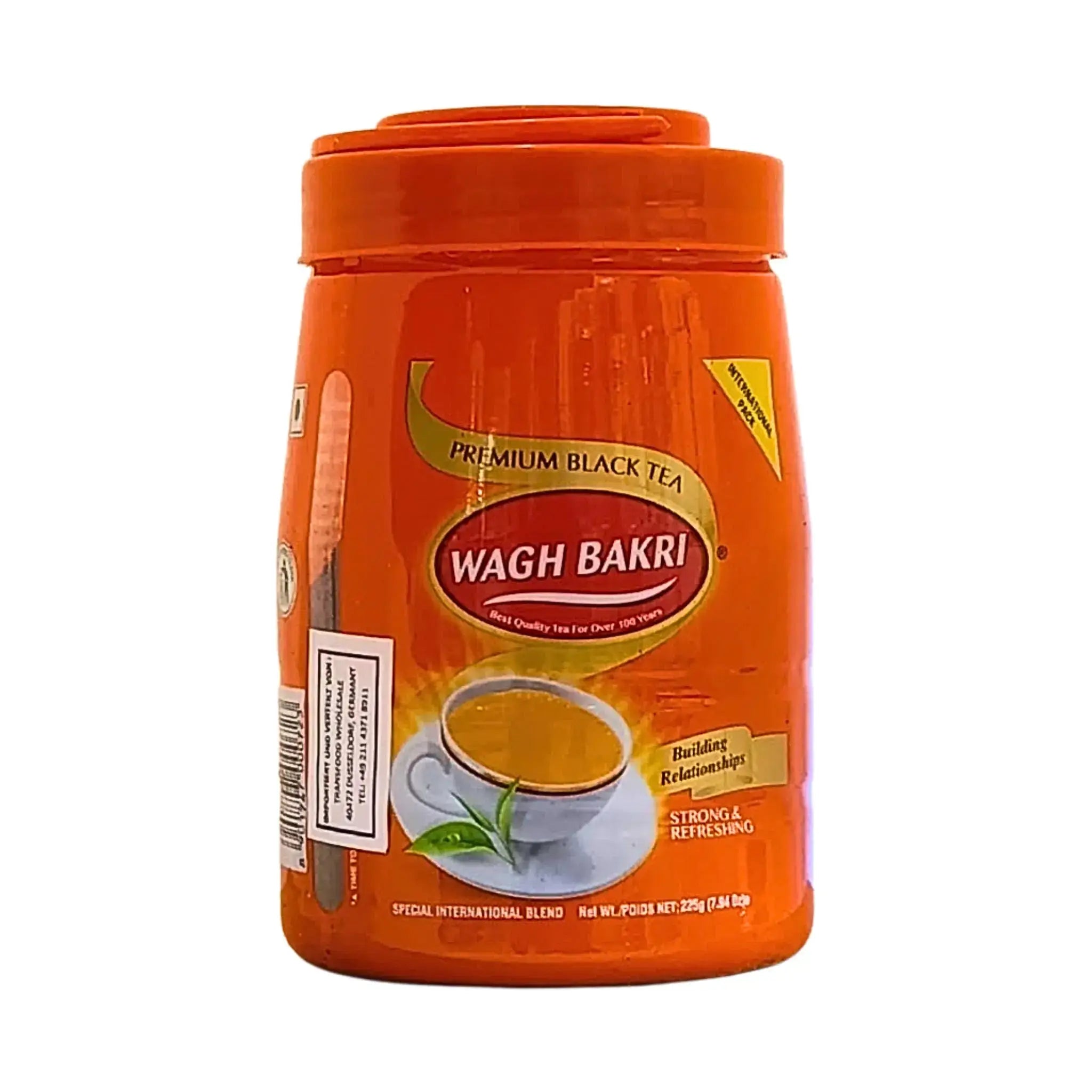 Wagh Bakri musta tee 225 g purkki, intialainen tee oranssissa pakkauksessa, teekuppi-kuvaus etiketissä.