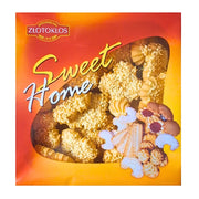 Rasia sekoitettuja seesam- ja pikkuleipiä, etiketti Sweet Home, keltainen ja punainen tausta.